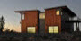 Stillwater Dwellings SE exterior at dusk.